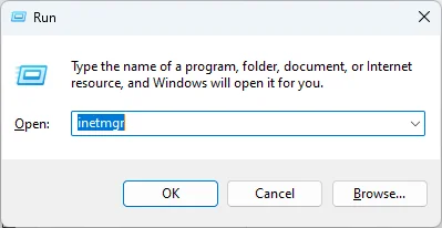 Windows Run dialog with inetmgr command typed